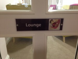 Close up of lounge door with graphic of chair