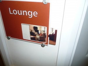 close up of lounge door signage example with sliding picture