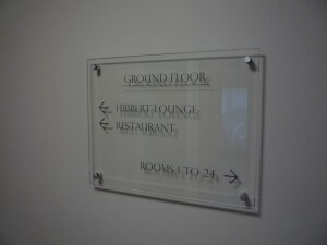 Ground floor glass sign on wall