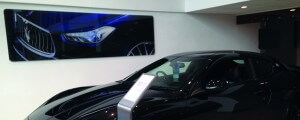 acrylic signage in a Maserati dealership