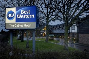 Best Western Gables sign with hotel behind