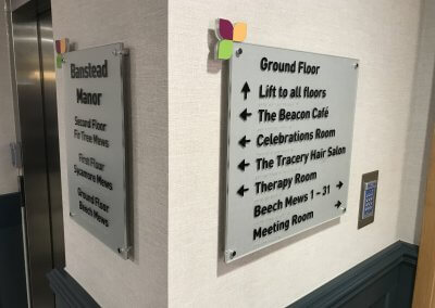 Care home wayfinding sign with braille